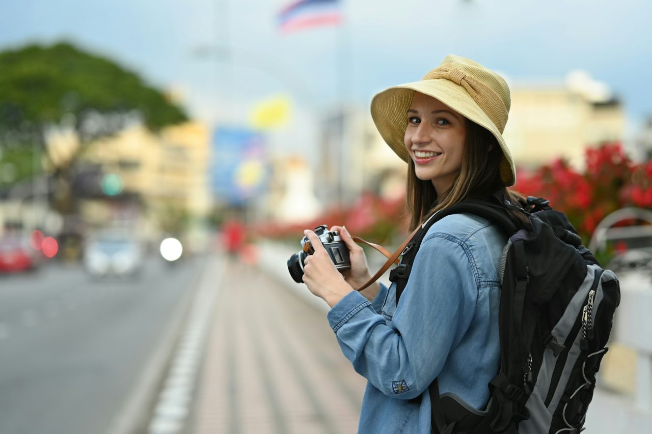 happy-caucasian-female-traveler-with-backpack-on-holiday-vacation-trip-in-thailand-.jpg